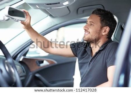 Young man in a inside the car
