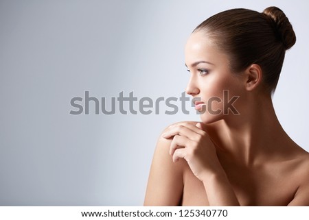 Young girl with her hair in a bun Young girl with her hair in a bun