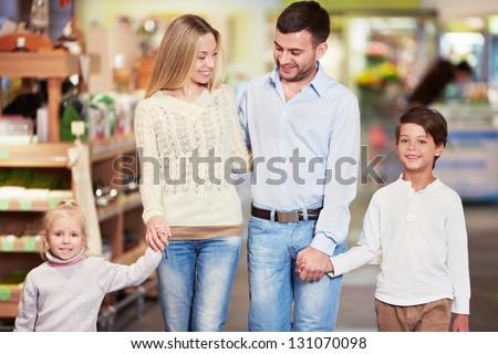 Family with children in the store