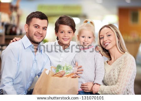 Family with children in shop