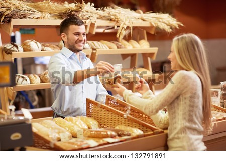 Young Girl In A Store Buying Product