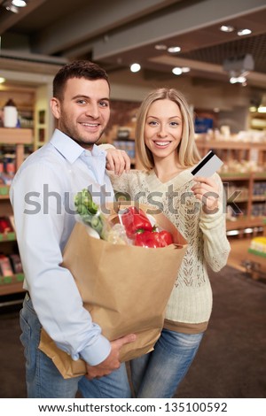 Smiling couple with a credit card