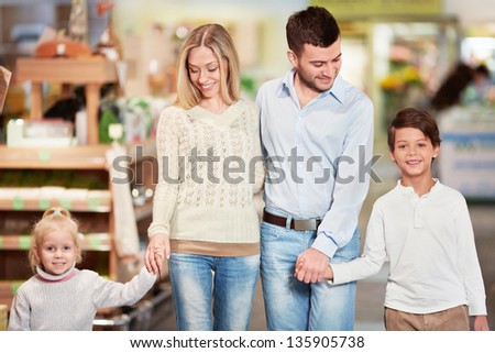 Family with children in a store