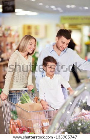 Family with a child in a store
