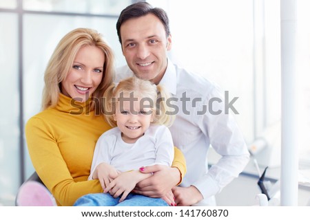 Family with child in a dental clinic