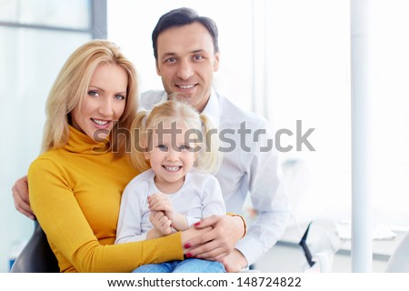 Smiling family in a dental clinic