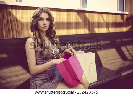 Young girl with bags for shopping