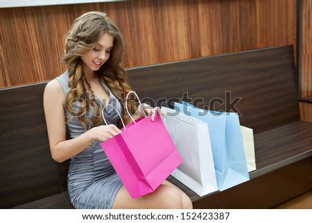 Young girl with bags for shopping