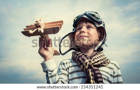 Pilot With Airplane On A Background Of Sky