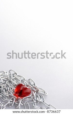 Red Heart laying in a metal chain in a corner of the staff
