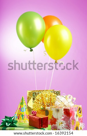 Set of multi-colored gifts in packings and balloons