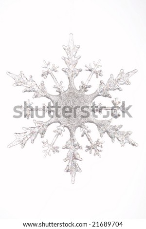 One silvery snowflake on a white background