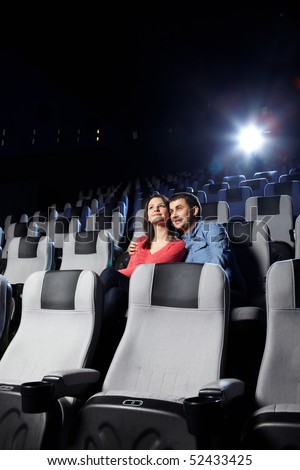 The happy enamoured couple looks cinema