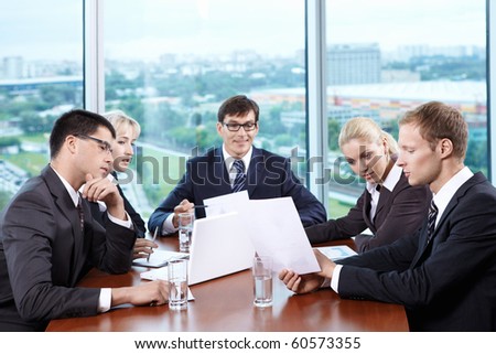 Team staff leads a discussion in the office