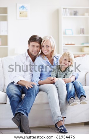Attractive young family with a child at home