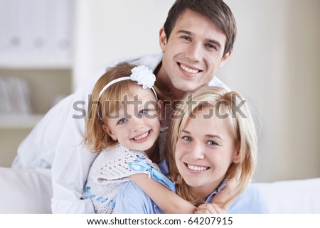 Two young parents with baby daughter
