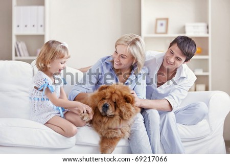 Young family with a dog at home