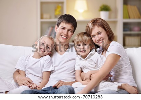 A happy family with children at home in the evening