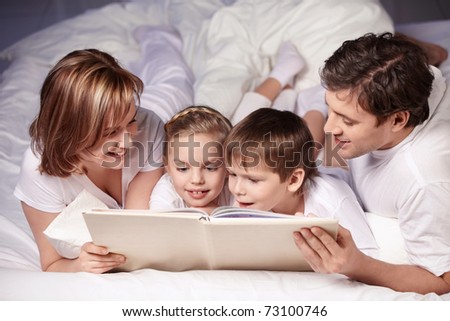 children reading with parents. stock photo : Parents with children are reading