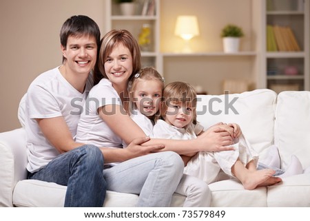 Family with children at home in the evening