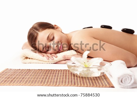 stock photo Young naked girl in a spa on a white background