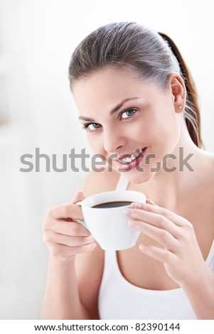 A beautiful girl with a cup of coffee