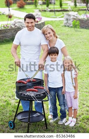 Families with children make barbecue