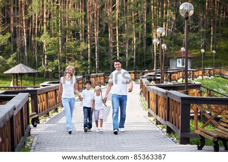 Walking family on the bridge