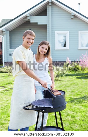 Young couple make the barbecue