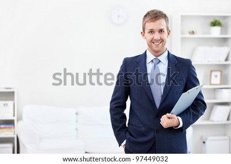 Business man with a clipboard at home