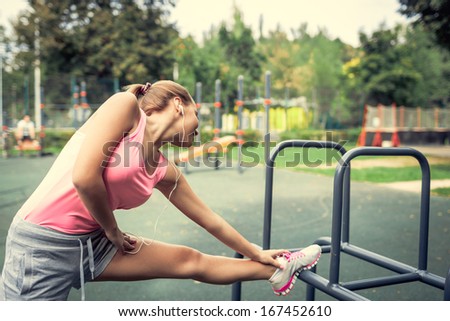 Attractive young woman doing stretching