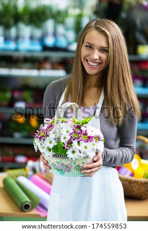 Young florist with a basket of flowers
