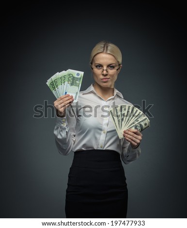Businesswoman with money in studio