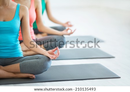 Young girls do yoga indoors
