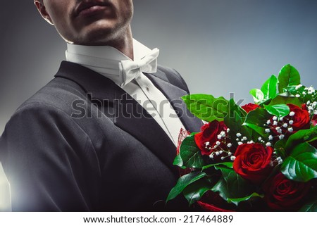 Young man with a bouquet of flowers