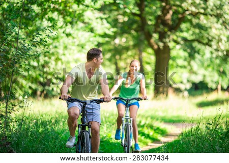 Active people on bicycles in summer