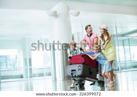 Family with a suitcase at the airport