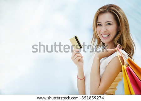 Beautiful young girl with credit card