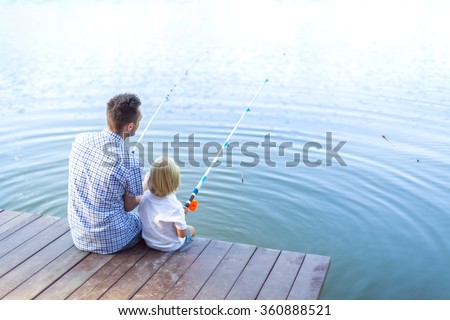 Father and son fishing on the lake
