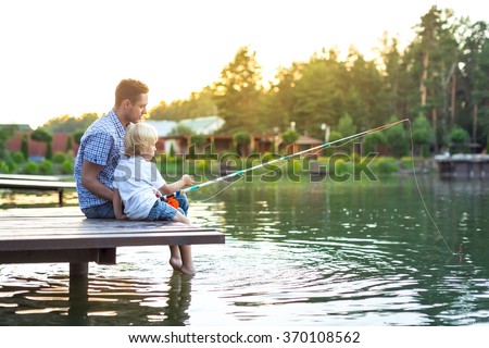 Father and son fishing on the lake