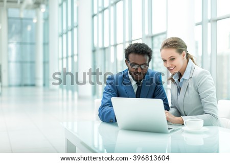 Business people with laptop in office