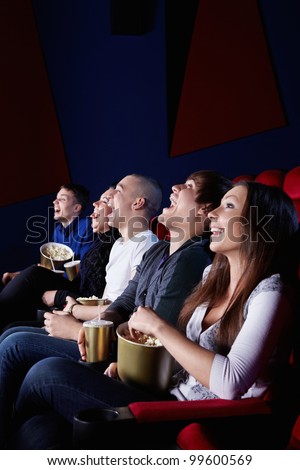 People laugh at the cinema