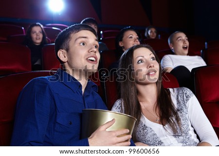 Surprised people in the cinema