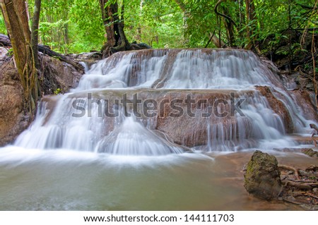 Waterfall in deep rain forest jungle. (Huay Mae Kamin Waterfall in Kanchanaburi Province, Thailand)
