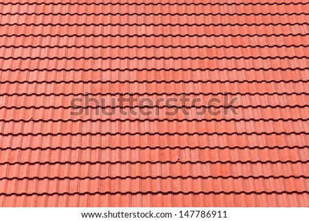 red tiles roof for background.