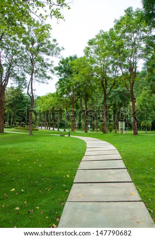 Walkway on green grassy in park.