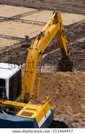 Excavator construction equipment park at worksite.