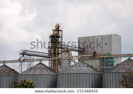 storage tanks in rice mill, factory process production line in thailand.