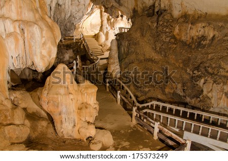 pathway underground cave in Laos, with stalagmites and stalactites.