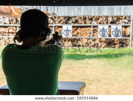 Outdoor gun shooting of target range.